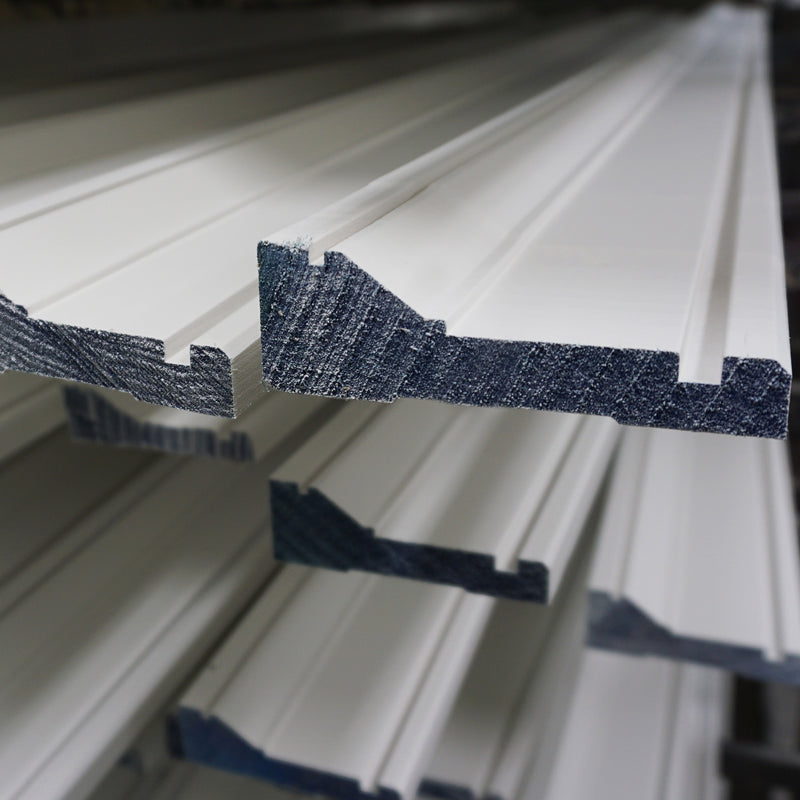 Stacked of primed mouldings.