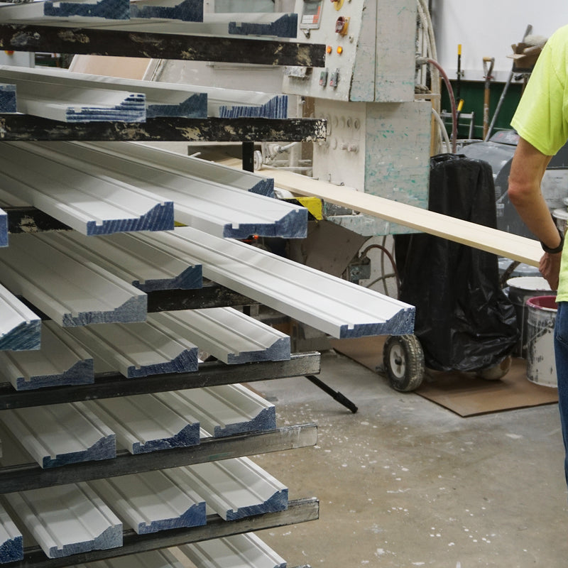 Stack of primed mouldings.