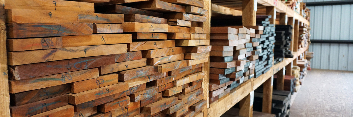 Lumber stacked within the Highland Hardwoods warehouse.