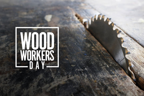 Table saw blade cutting through a piece of lumber.