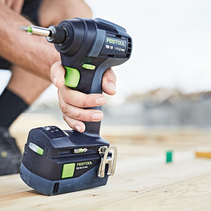 Man holding a Festool power drill.